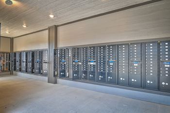 a large storage room with many lockers in a building